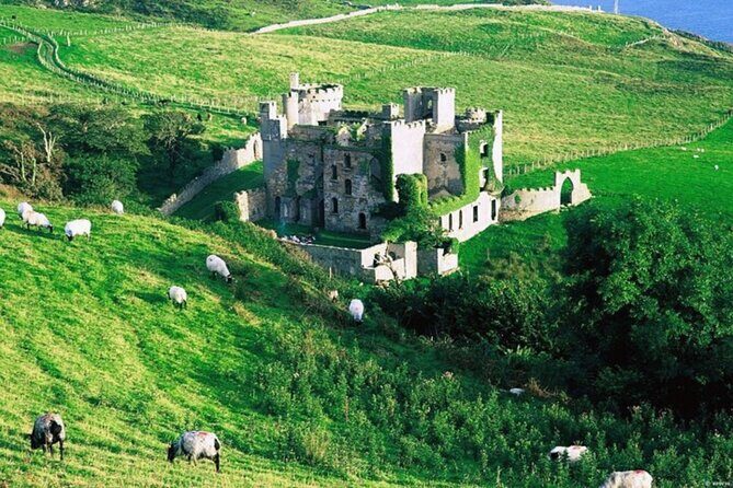 Castles of Connemara tour departing Galway city. Guided. Full day - Clifden Castle ruins on the Sky Road and Ballynahinch Lough views