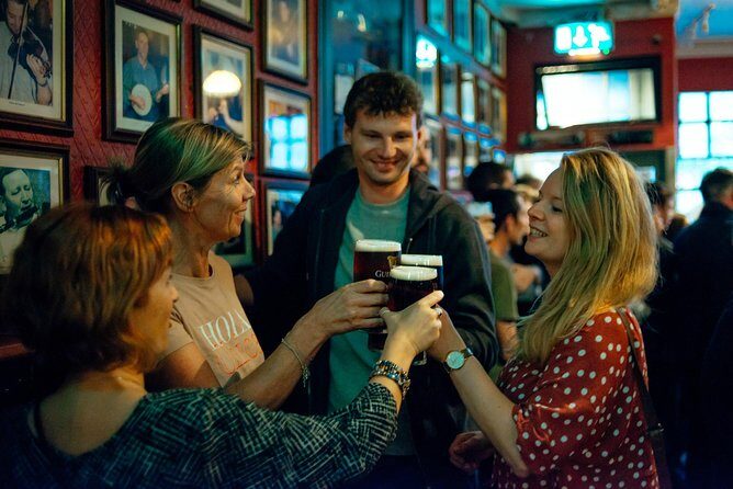 Classic Irish Pubs Private Tour of Dublin: Live Music, Beer and Nightlife - Entering the Temple Bar area with a host who sets the tone
