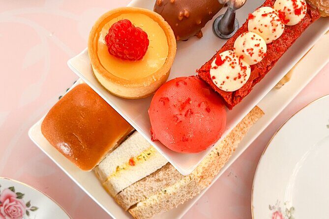 Irish Afternoon Tea on 1960s Vintage Bus in Dublin - What’s on the tea tray: sandwiches, scones, and a full dessert spread